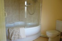 Pheasant cottage corner bath with independent shower unit