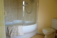 corner bath with independent shower unit